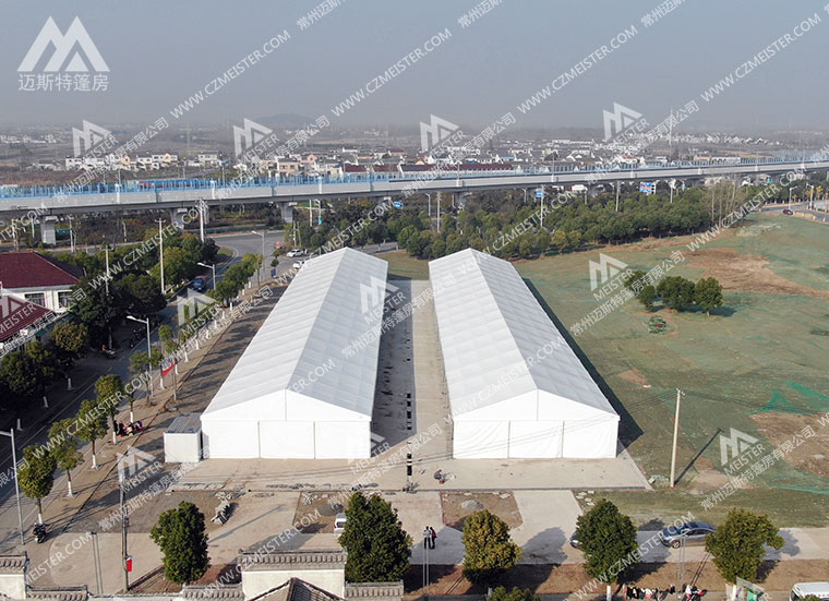 铝合金篷房解决违建烦恼:如何利用“临时建筑”属性合法快速落地仓储与展厅?